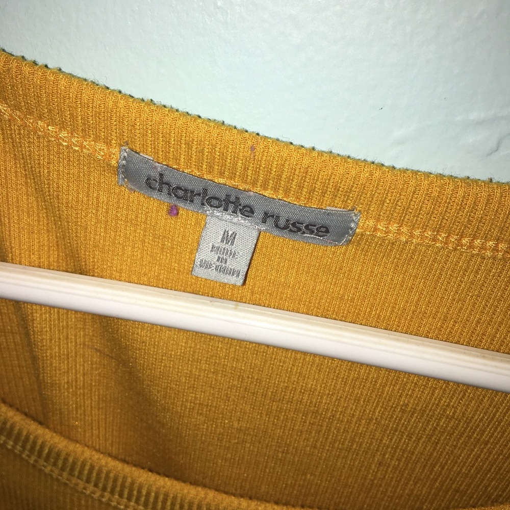 A mustard color crop top